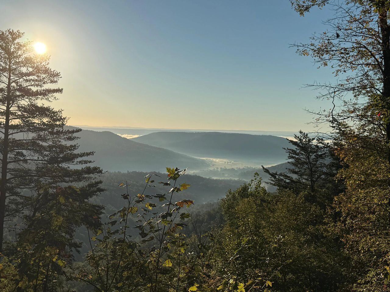 Sunrise view over a fog-filled valley from the bluff at Sasquatch Farm RV Park